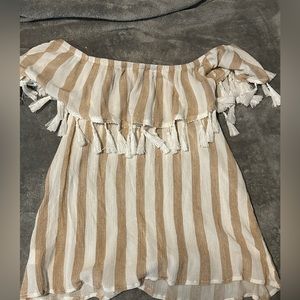 A medium size brown, and white blouse with tinsel